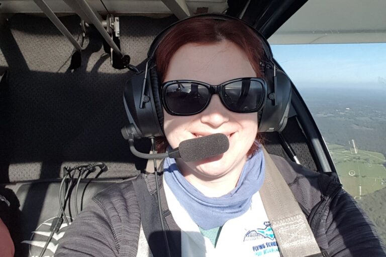 This photo is of Rebecca Giddings flying a plane. It is the header image for a blog post on the Urostomy Association's website.