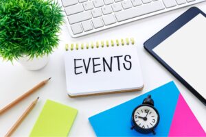 This photo is of a notepad with the word 'events' written on it. It is the header image for page on the Urostomy Association's website which describes the events which urostomates might like to attend