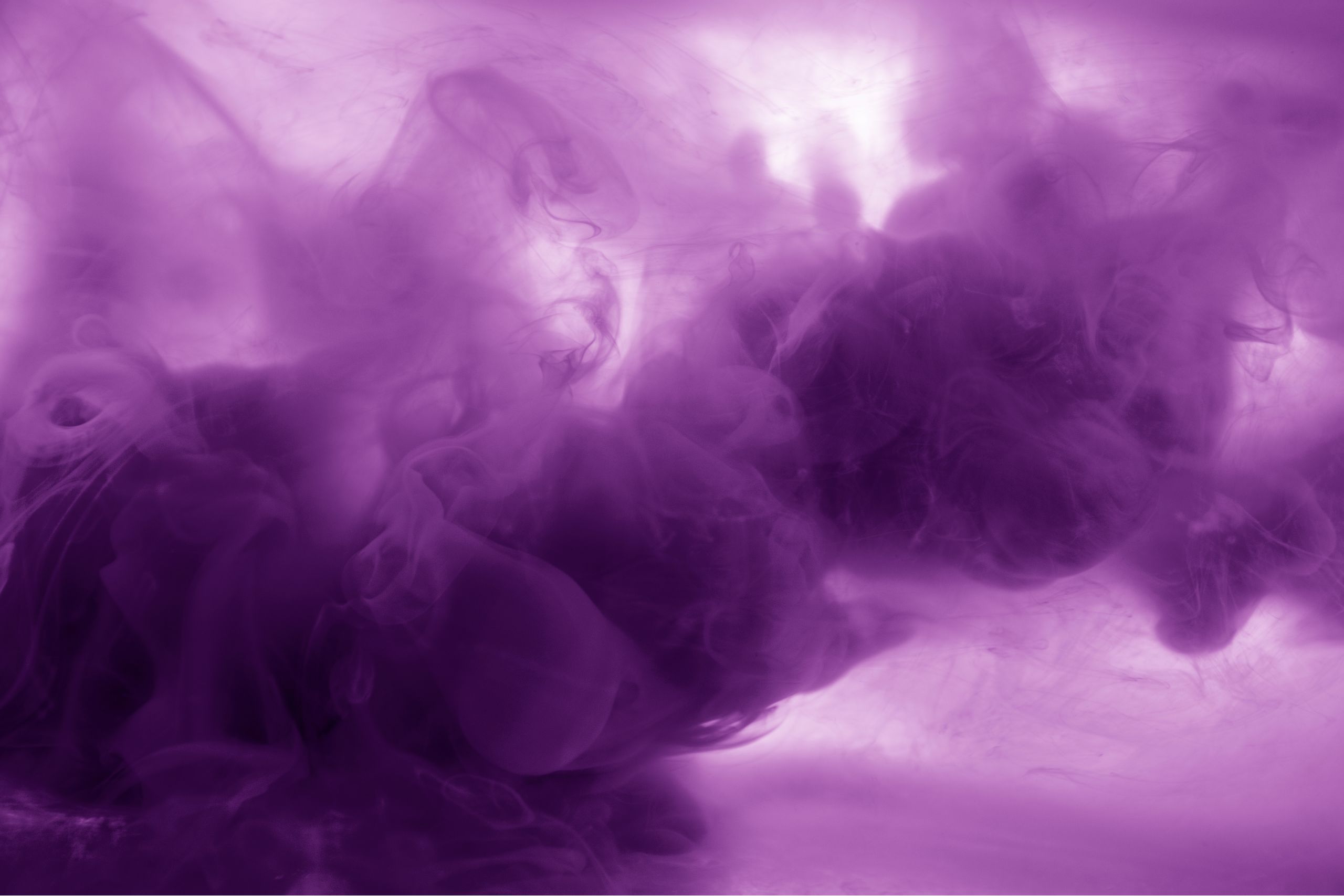 This is a photo of liquid that is a cloudy purple. It is the header image for the 'What is purple urinary bag syndrome' article on the Urostomy Association's website