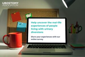 This is a photo of a computer screen which reads "Help uncover the real-life experiences of people living with urinary diversions. Share your experiences with our online survey".